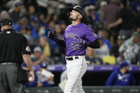 Colorado Rockies' Sam Hilliard gestures as he crosses home plate after hitting a two-run home run off Los Angeles Dodgers relief pitcher Alex Vesia in the seventh inning of a baseball game Wednesday, Sept. 22, 2021, in Denver. (AP Photo/David Zalubowski)