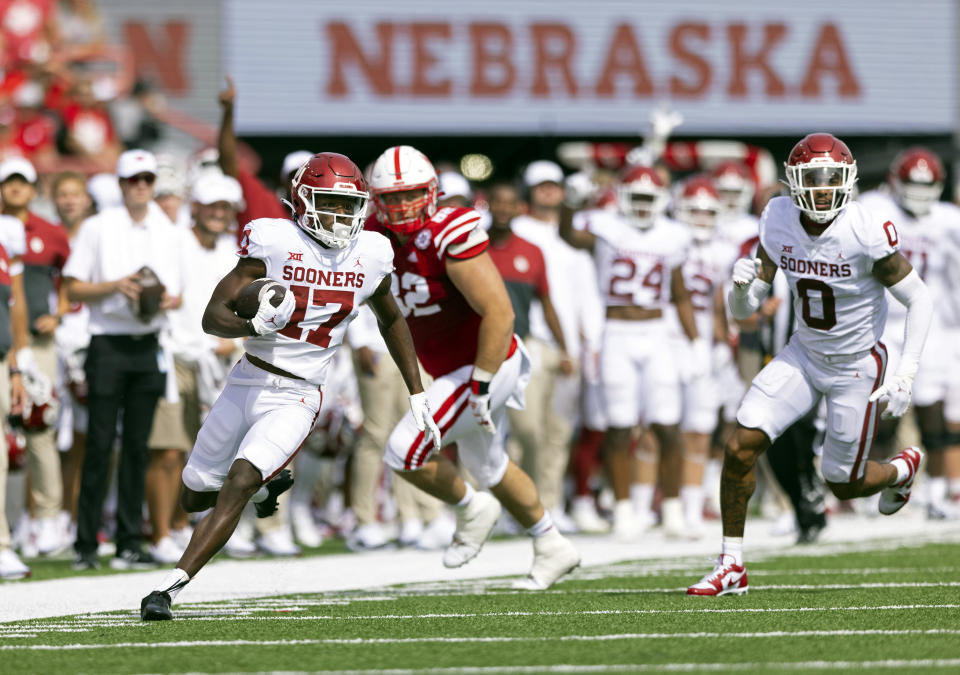 Oklahoma's Marvin Mims Jr. (17) carries a punt return against Nebraska during the first half of an NCAA college football game Saturday, Sept. 17, 2022, in Lincoln, Neb. (AP Photo/Rebecca S. Gratz)