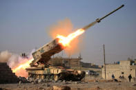 Iraqi army launch a rocket towards Islamic State militants during a battle with Islamic State militants near Ghozlani military complex, south of Mosul. REUTERS/Alaa Al-Marjani