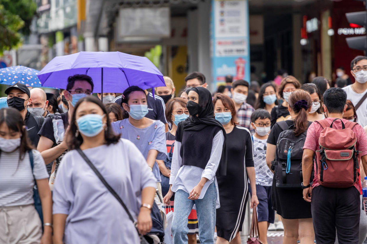 People wearing face masks along Orchard Road in Singapore. 