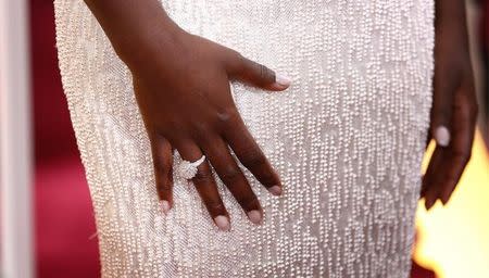 Actress Lupita Nyong'o wears a Calvin Klein gown and Chopard diamonds as she arrives at the 87th Academy Awards in Hollywood, California February 22, 2015. REUTERS/Lucas Jackson