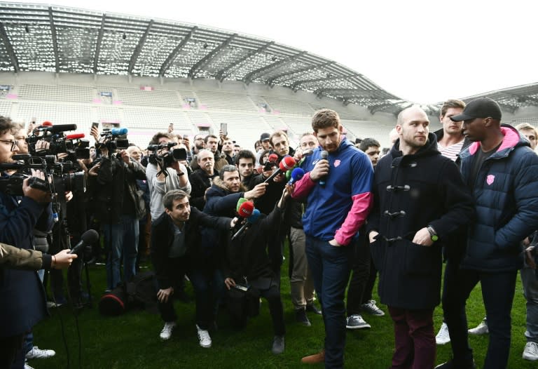 Stade Francais' lock Pascal Pape speaks to journalists at the Stade Jean Bouin in Paris on March 13, 2017, during a demonstration of supporters and players after French rugby giants Racing 92 and Stade Francais announced a shock merger