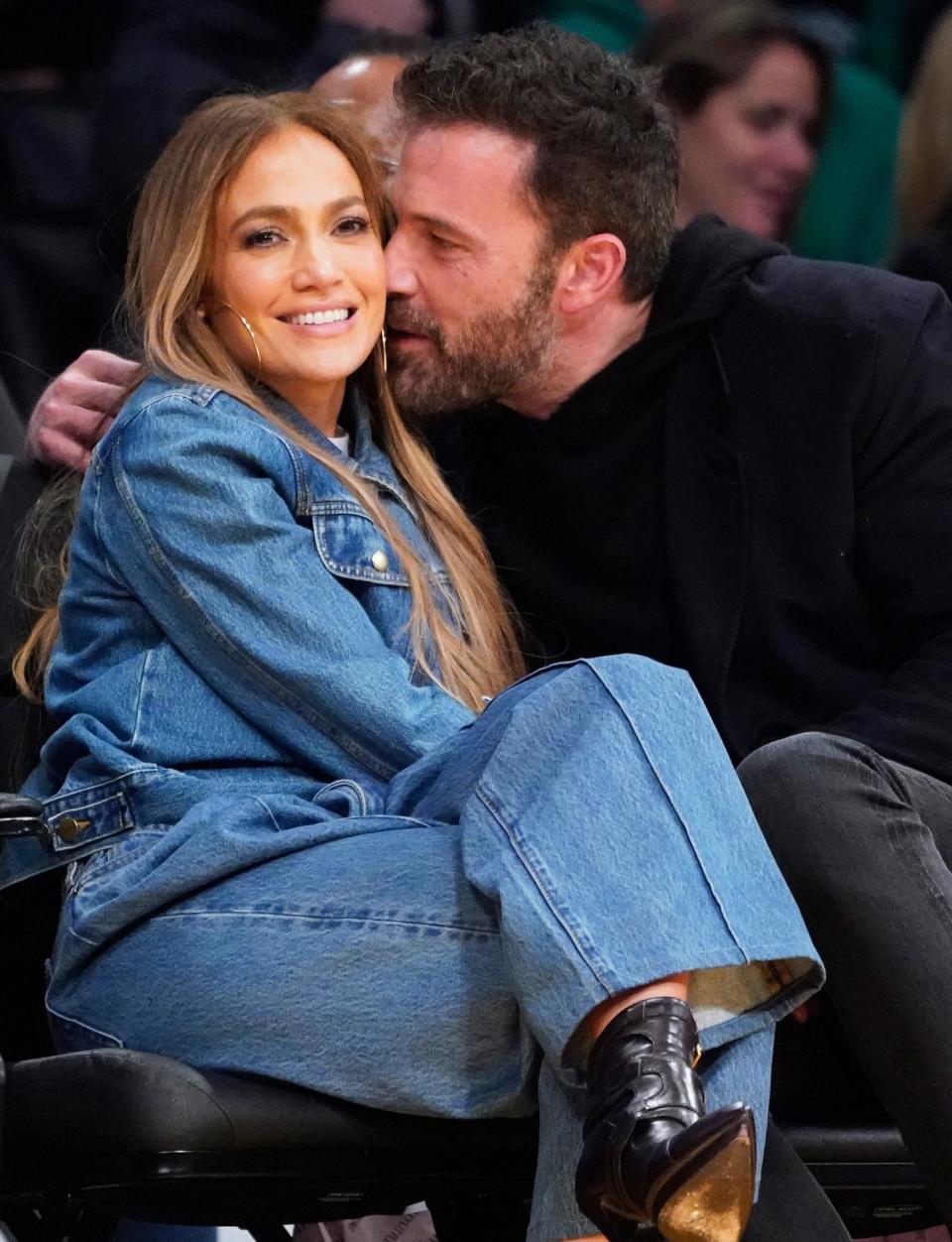 <p>The couple <a href="https://people.com/movies/jennifer-lopez-and-ben-affleck-get-affectionate-while-sitting-courtside-at-lakers-celtics-game/" rel="nofollow noopener" target="_blank" data-ylk="slk:shared a courtside kiss;elm:context_link;itc:0;sec:content-canvas" class="link ">shared a courtside kiss</a> while watching a L.A. Lakers game on Dec. 7, 2021. </p>