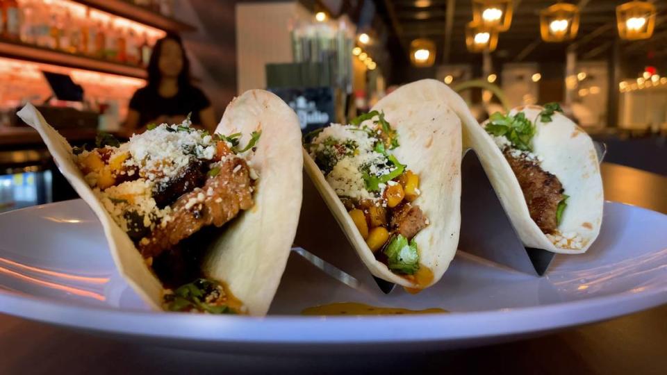 These flank steak tacos, on three corn tortillas, are topped with roasted corn salsa, Cotija cheese, and chimichurri sauce. 09/19/2023