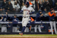 Houston Astros Jose Altuve (27) scores on a base hit by Yordan Alvarez against the New York Yankees during the seventh inning of Game 4 of an American League Championship baseball series, Sunday, Oct. 23, 2022, in New York. (AP Photo/John Minchillo)
