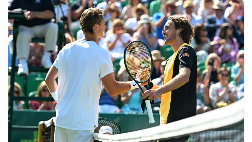 Stefanos and Sebastian shake hands following their match