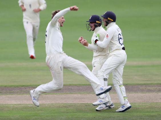 Joe Root celebrates taking the wicket of Rassie van der Dussen (Reuters)