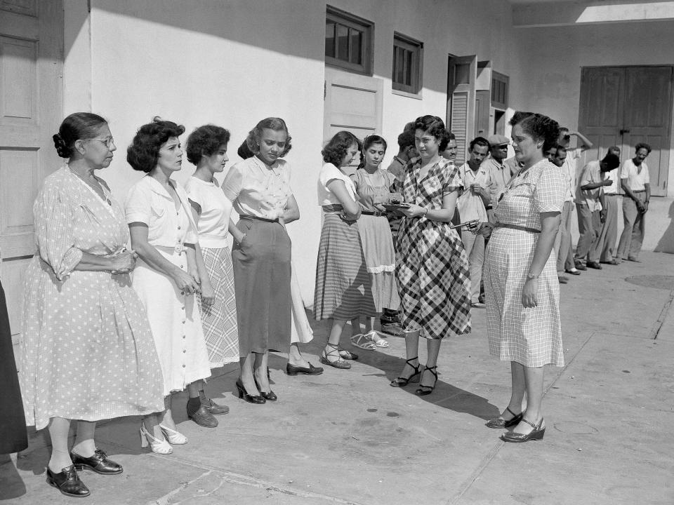 Women lined up at police headquarters during a roundup of suspected nationalists after an aborted revolt in San Juan, Puerto Rico, 1950.