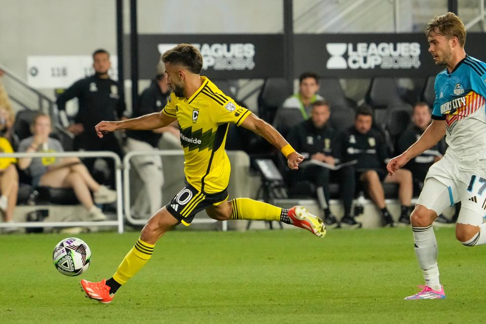 Aug 9, 2024; Columbus, OH, USA; Columbus Crew forward Diego Rossi (10) scores a goal in front of Sporting Kansas City midfielder Jake Davis (17) during the second half of the Leagues Cup soccer match at Lower.com Field. The Crew won 4-0.