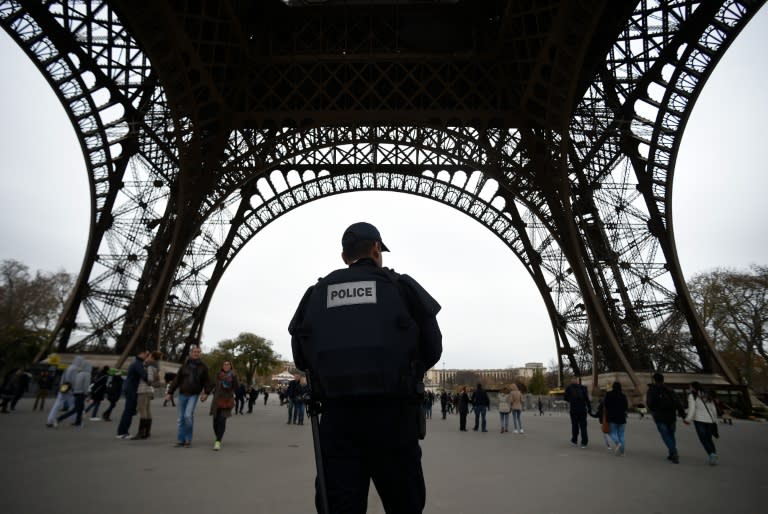 Police patrol in Paris on November 14, 2015 at the Eiffel Tower