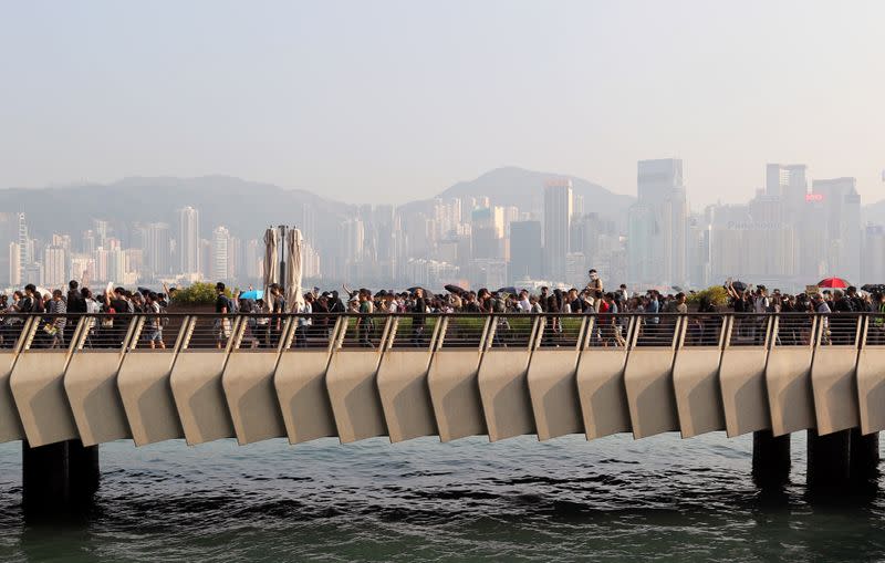 Anti-government protesters march during the "Lest We Forget" rally in Hong Kong