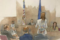 In this courtroom sketch, defendant Harvey Weinstein, far left, listens, as Assistant District Attorney Megan Hast, standing before the bench second from right, gestures while witness Mimi Haleyi, far right, holds a microphone during Haleyi's testimony in Weinstein's sexual misconduct and rape trial, Monday, Jan. 27, 2019, in Manhattan Supreme Court in New York. Supreme Court Judge James Burke, above, is shown seated between two flags. Haleyi testified Monday that weeks after arriving in New York to work for one of his shows, she found herself fighting in vain as the once-revered showbiz honcho pushed her onto a bed and sexually assaulted her, undeterred by her kicks and pleas of, "no, please don't do this, I don't want it." (Aggie Kenny via AP)