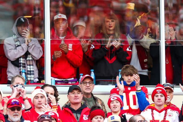 <p>Jamie Squire/Getty</p> Taylor Swift, Aric Jones and friends at the Kansas City Chiefs vs. Buffalo Bills game on Dec. 10, 2023