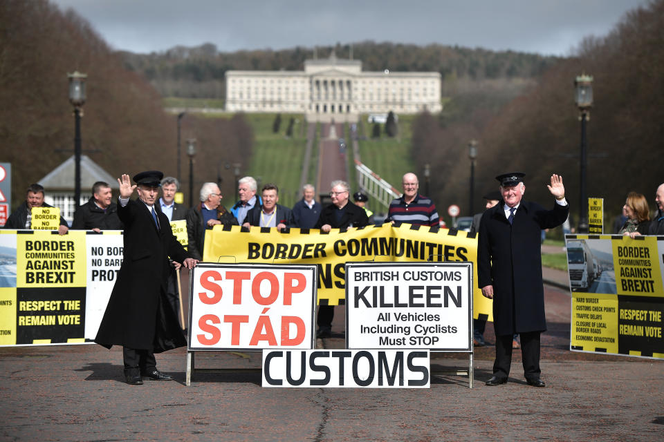 Two men dressed as customs officers take part in a protest outside Stormont against Brexit and its possible effect on the north and south Irish border on March 29, 2017 in Belfast, Northern Ireland.