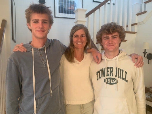 Tommy Hanna, right, with mom Lexie and brother and Tower Hill soccer teammate Bo.