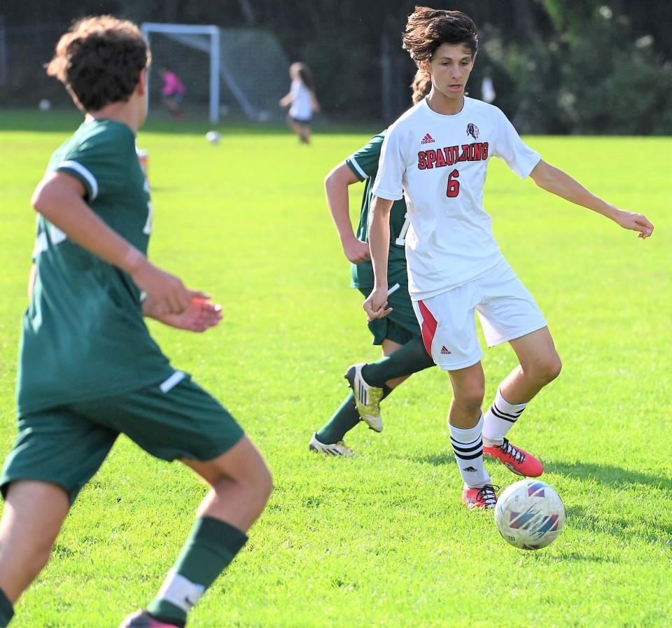 Spaulding senior forward Matthew Scamman brings the ball up the field during Thursday's Division I boys soccer match at Dover. Spaulding won 1-0.