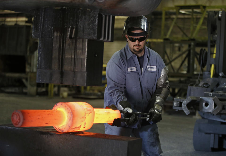 In this Thursday, Sept. 6, 2012, photo, Jack Knox positions a hot spindle being shape at Solmet Technologies in Canton, Ohio. U.S. manufacturing grew for the first time in four months, buoyed by a jump in new orders in September. The increase was a hopeful sign that the economy is improving. The Institute for Supply Management, a trade group of purchasing managers, said Monday, Oct. 1, 2012, that its index of factory activity rose to 51.5. That's up from 49.6 in August. (AP Photo/Mark Duncan)