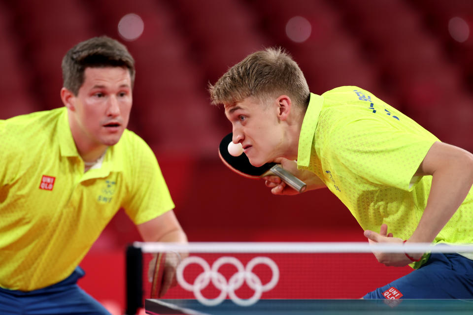 <p>Anton Kaellberg (R) and Kristian Karlsson of Team Sweden in action during their Men's Team Round of 16 table tennis match on day ten of the Tokyo 2020 Olympic Games at Tokyo Metropolitan Gymnasium on August 02, 2021 in Tokyo, Japan. (Photo by Jamie Squire/Getty Images)</p> 