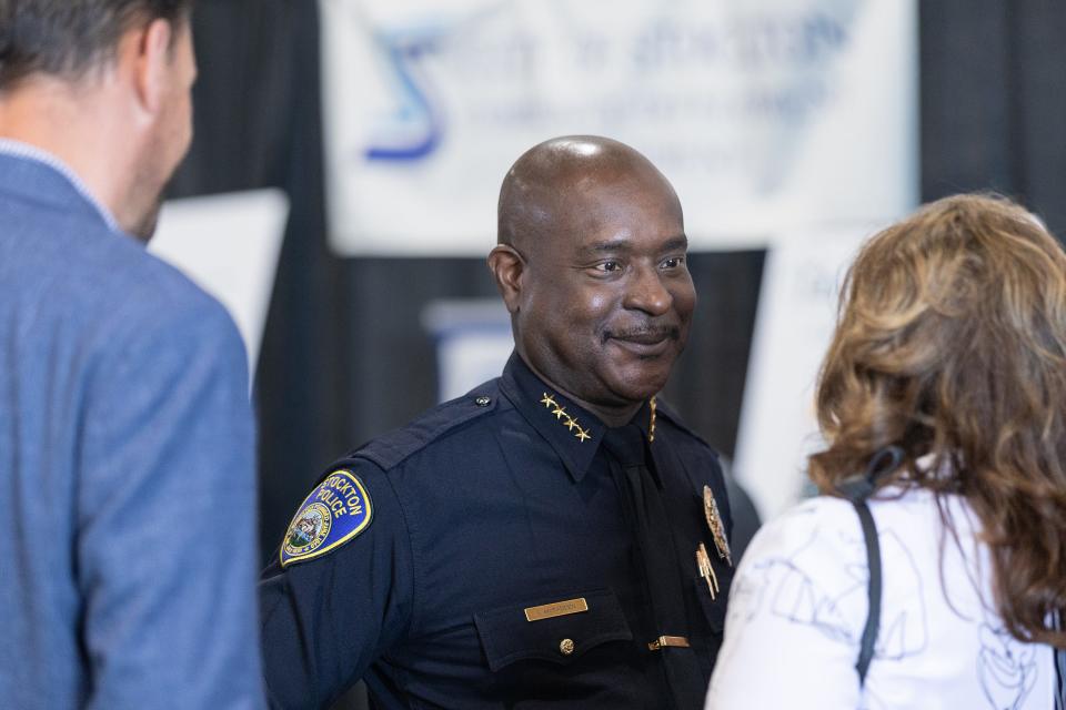 Police Chief Stanley McFadden talks with attendees at the 2023 State of the City. “We have a great number of dedicated, passionate, honorable yet exhausted employees,” a June memo from McFadden and addressed to city leaders reads.