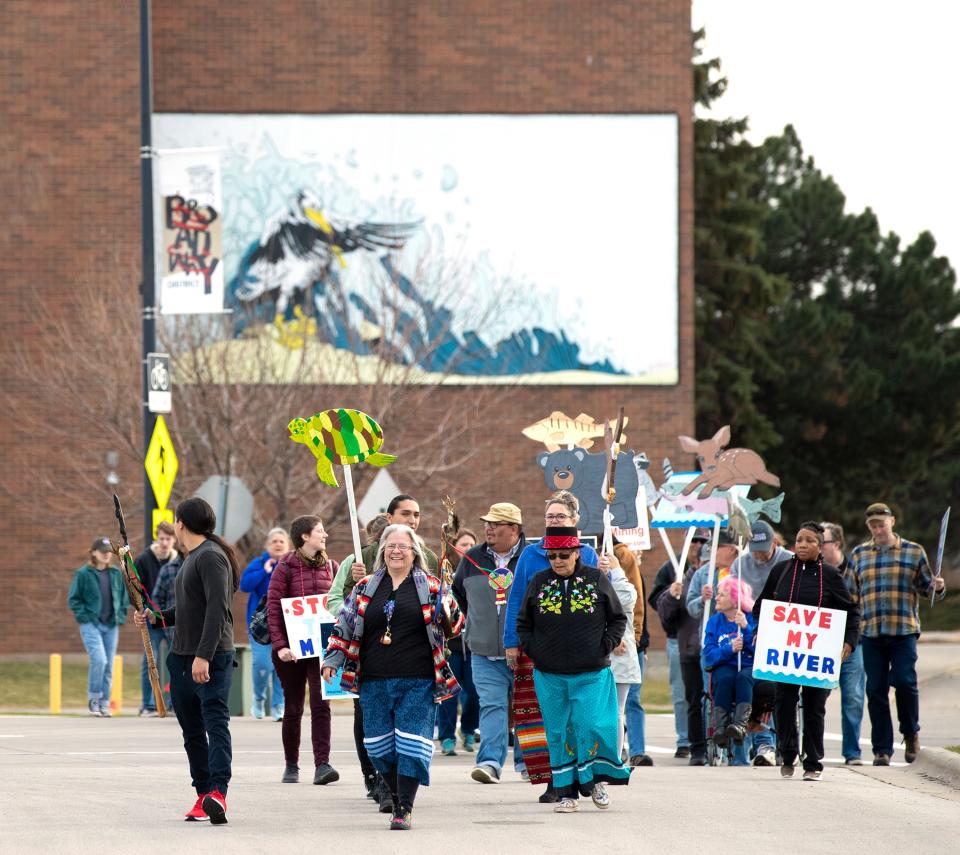 Portesters march to the Leicht Memorial Park for the Rally to Protect Clean Water, Friday, April 29, at the CityDeck in Green Bay, Wis. The Indigenous-led protest is  against the Line 5 oil pipeline and the Back 40 Mine. Samantha Madar/USA TODAY NETWORK-Wisconsin 