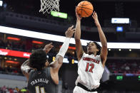 Louisville forward JJ Traynor (12) shoots over Georgia Tech forward Javon Franklin (4) during the second half of an NCAA college basketball game in Louisville, Ky., Wednesday, Feb. 1, 2023. Louisville won 68-58. (AP Photo/Timothy D. Easley)