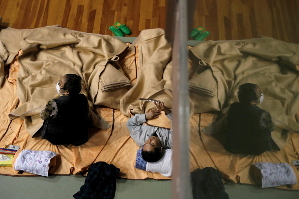 People rest in the evacuation centre for affected by the flood after Typhoon Hagibis in Nagano, Nagano Prefecture, Japan, Oct. 13, 2019. (Photo: Kim Kyung Hoon/Reuters)