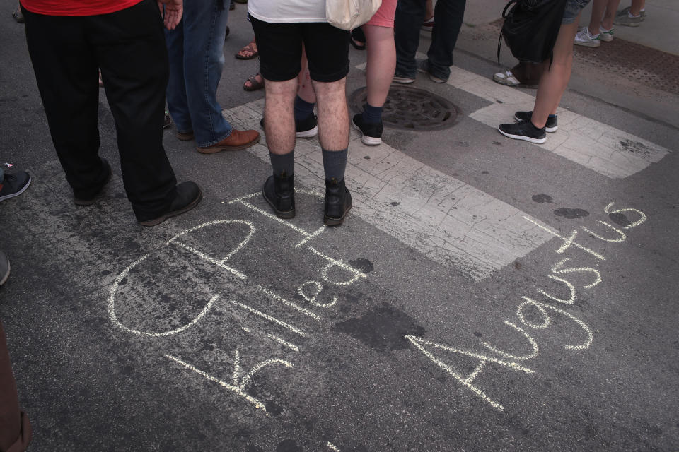 <p>Demonstrators rally in the South Shore neighborhood protesting the shooting death of 37-year-old Harith Augustus on July 16, 2018 in Chicago, Ill. (Photo: Scott Olson/Getty Images) </p>