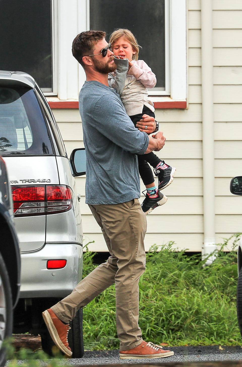 Chris Hemsworth comforts daughter on family day out in Byron Bay