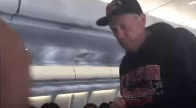 A passenger filmed the man's removal from the aircraft. Picture: YouTube