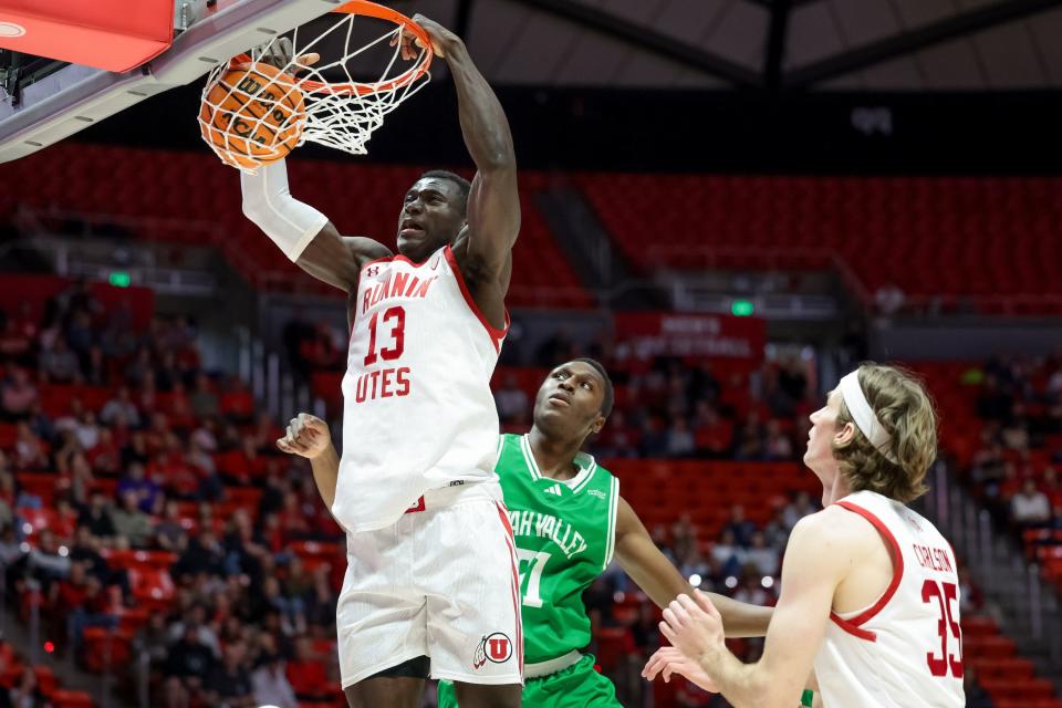 Utah Utes center Keba Keita (13) dunks during the game against the Utah Valley Wolverines at the Huntsman Center in Salt Lake City on Saturday, Dec. 16, 2023. | Spenser Heaps, Deseret News