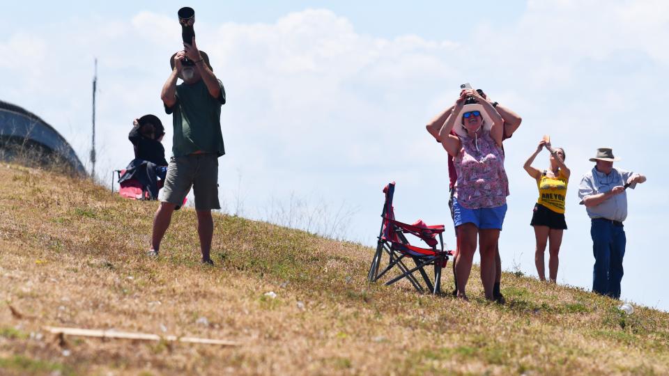 Spectators along the Beachline Expressway watch Monday's SpaceX Falcon 9 rocket launch.