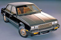 <p>The tale of the Cimarron reads as one of half-heartedness. Introduced in 1982 it was a product of pressure. Cadillac, concerned about overseas manufacturers stealing sales, insisted GM give them a car to develop using an existing platform. The problem was, they had just one year to do it.</p><p>The solution was to fully spec-up the Chevrolet Cavalier, rebadge it, and market it as “The Cimarron by Cadillac” for a <strong>$4000 </strong>premium. Despite selling a steady 20,000 cars per year, customers saw through this poor disguise and sales of the Cimarron slowly burned to the ground after 6 years.</p><p><strong>PICTURE: </strong>1983 model</p>