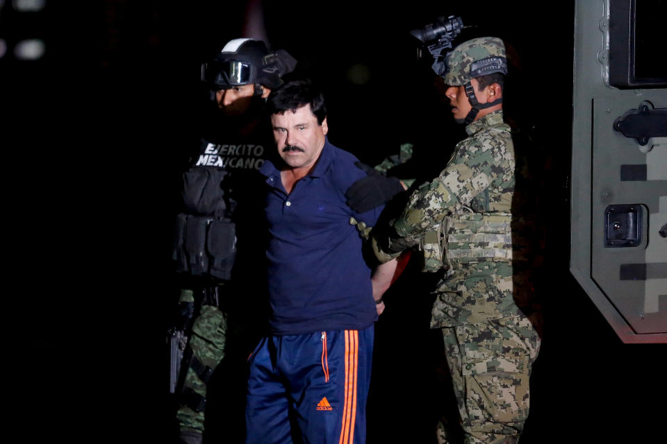 FILE PHOTO: Joaquin "El Chapo" Guzman is escorted by soldiers during a presentation in Mexico City, January 8, 2016. REUTERS/Tomas Bravo/File photo