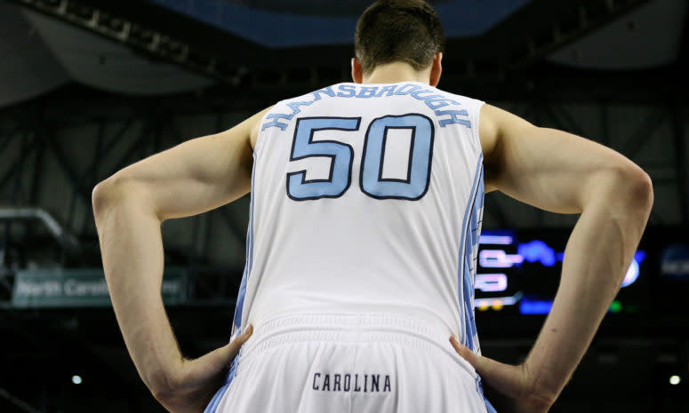 Tyler Hansbrough stands on the court.