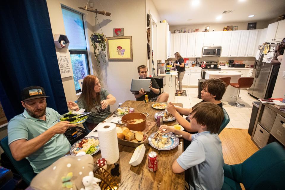 Stephanie Nordin eats dinner with her family at their Naples home on Monday, April 15, 2024. The mother of four has become successful at champion-ing some legislation for the state to protect children with autism(1,900 kids in Collier are on then spectrum) and some changes to local parks as well. Pictured are from top going clockwise, Logan Nordin, Eli Nordin, Titus Nordin and Adam Johnson.