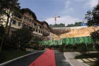 A general view of houses for sale at the replica village of Austria's UNESCO heritage site, Hallstatt, in China's southern city of Huizhou in Guangdong province, June 1, 2012. Metals and mining company China Minmetals Corporation spent $940 million to build this controversial site and hopes to attract both tourists and property investors alike.