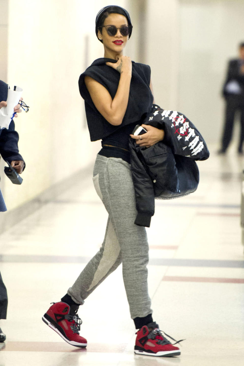 Rihanna adds a red lip and matching kicks to take her loungewear to its cutest possible conclusion.