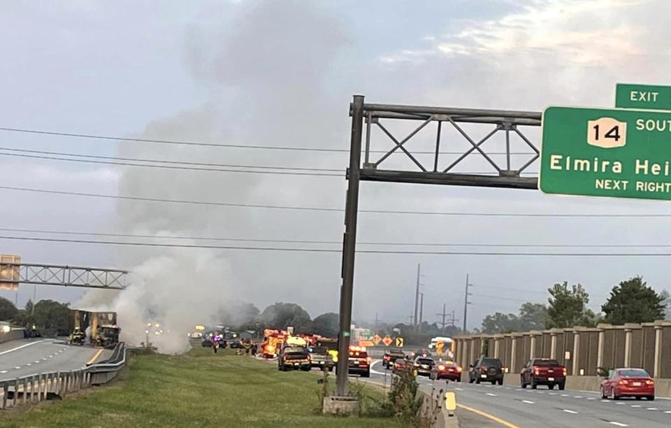 A tractor trailer sends billows of smoke into the air after overturning in the eastbound lane of Interstate 86 in Horseheads on Tuesday, Sept. 17, 2024. The crash forced much of the interstate traffic to be rerouted.