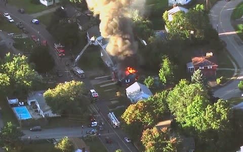 Emergency crews respond to a series of gas explosions that have damaged homes across three communities north of Boston - Credit:  WCVB