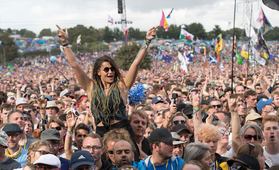 <p>Music fans cheer as Royal Blood on the Pyramid Stage at the Glastonbury Festival site at Worthy Farm in Pilton on June 23, 2017 near Glastonbury, England. (Photo: Matt Cardy/Getty Images) </p>