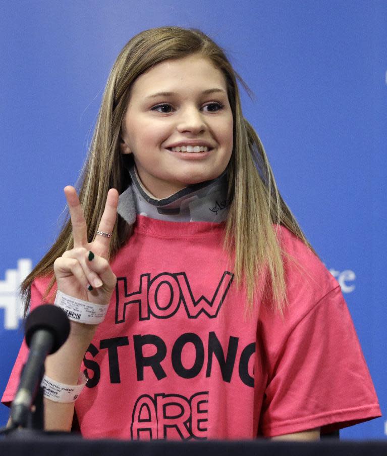 Makenzie Wethington gestures as she speaks at a news conference at Baylor University Medical Center Thursday, Feb. 13, 2014, in Dallas. Wethington spoke for the first time publicly since she survived a fall of more than 3,000 feet in a Jan. 25, 2014 skydiving accident in Oklahoma. Her doctor has said she's walking with assistance and is expected to recover. Her injuries included damage to her liver and a broken pelvis, lumbar spine in her lower back, shoulder blade, several ribs and teeth. (AP Photo/LM Otero)