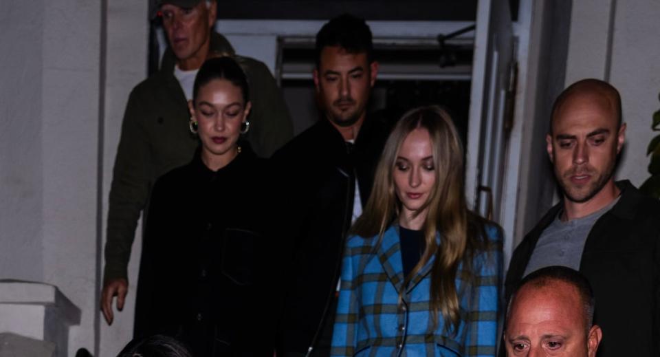 closeup of gigi and sophie leaving a restaurant