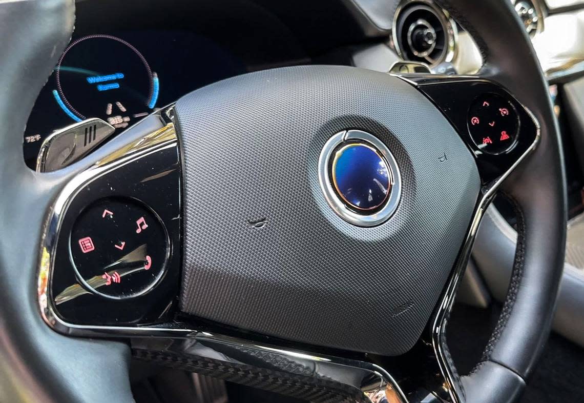 The steering wheel of the Karma Revero features the company’s eclipse logo and buttons to control phone, music and cruise control. Hector Amezcua/hamezcua@sacbee.com