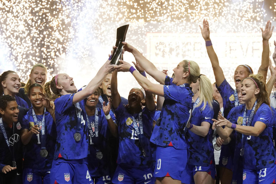 United States women's soccer team lifts up and celebrates the SheBelieves Cup after winning the soccer match against Brazil 2-0 Wednesday, Feb. 22, 2023, in Frisco, Texas. (AP Photo/LM Otero)