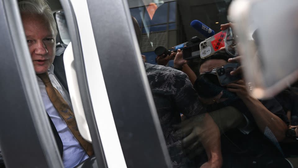 Members of the media surround the vehicle of WikiLeaks founder Julian Assange as he leaves the US Federal Courthouse in Saipan, Northern Mariana Islands, on June 26, 2024. - Yuichi Yamazaki/AFP/Getty Images