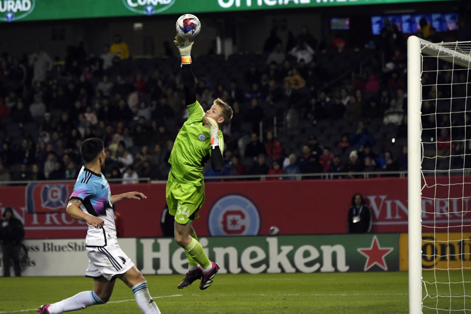 Chicago Fire goalie Chris Brady makes a save during the first half of an MLS soccer game against Minnesota United Saturday, April 8, 2023 in Chicago. Chicago won 2-1. (AP Photo/Paul Beaty)