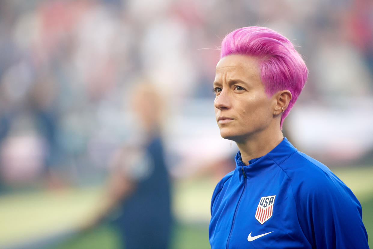 U.S. Soccer will no longer require national team players to stand for the national anthem. The rule was introduced after USWNT star Megan Rapinoe (second from left) knelt to protest social injustice in 2016. (Photo by Hannah Foslien/Getty Images)