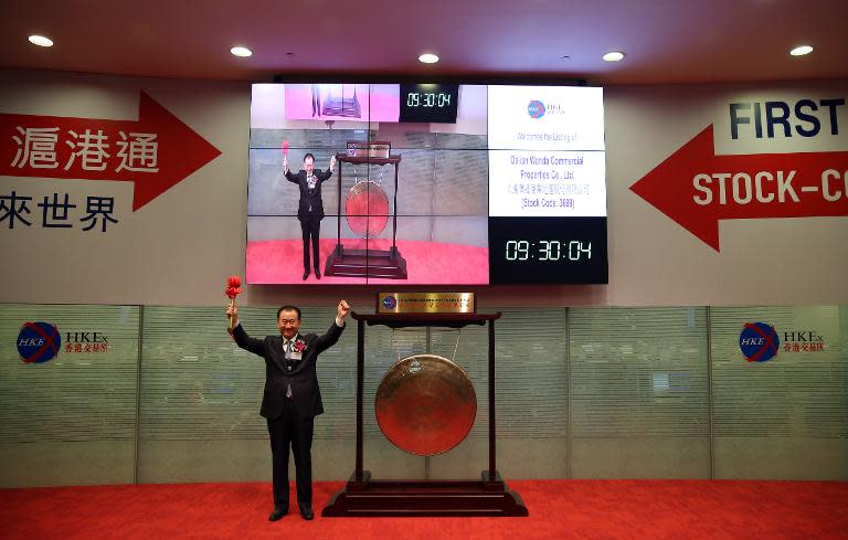 Wang Jianlin, CEO of Dalian Wanda Commercial Properties Co. opens trading during the company's IPO at the Hong Kong stock exchange on December 23, 2014