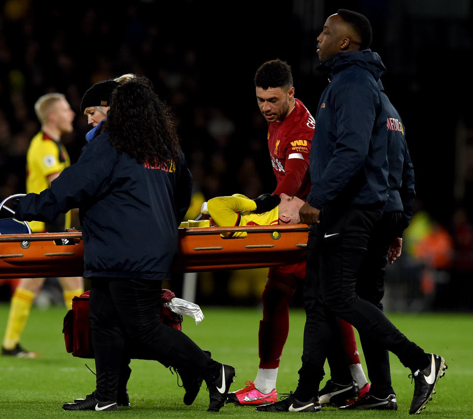 WATFORD, ENGLAND - FEBRUARY 29: (THE SUN OUT, THE SUN ON SUNDAY OUT) Alex Oxlade-Chamberlain of Liverpool consoles with Gerard Deulofeu of Watford as he is stretchered off with an injury during the Premier League match between Watford FC and Liverpool FC at Vicarage Road on February 29, 2020 in Watford, United Kingdom. (Photo by John Powell/Liverpool FC via Getty Images)