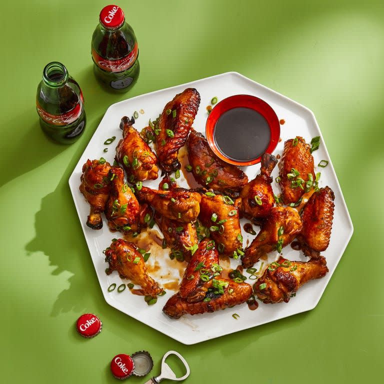 <p>These are sure to be a crowd-pleasing appetizer at any party. They bring together Coca-Cola, soy sauce, garlic, and ginger in a delicious glaze.</p><p>Get the <a href="https://www.goodhousekeeping.com/food-recipes/a39751314/coca-cola-chicken-wings-recipe/" rel="nofollow noopener" target="_blank" data-ylk="slk:Coca-Cola Chicken Wings recipe;elm:context_link;itc:0;sec:content-canvas" class="link "><strong>Coca-Cola Chicken Wings recipe</strong></a>.</p>